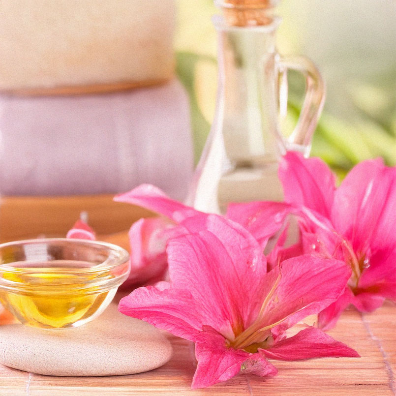 Spa decorations with flowers, towels and oil